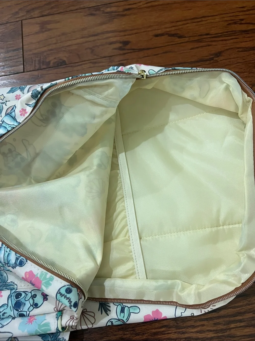 Disney Loungefly Cream Backpack with Aqua Stitch & Green Frog Print